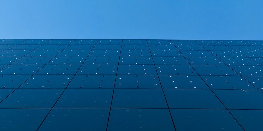 blue sky over black and white concrete building